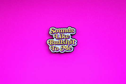 sounds like bullshit sarcastic enamel pin by Petty & Unhinged